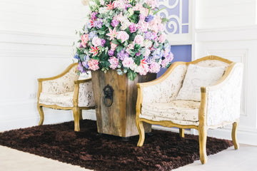 Elegant chairs with flower vase in between